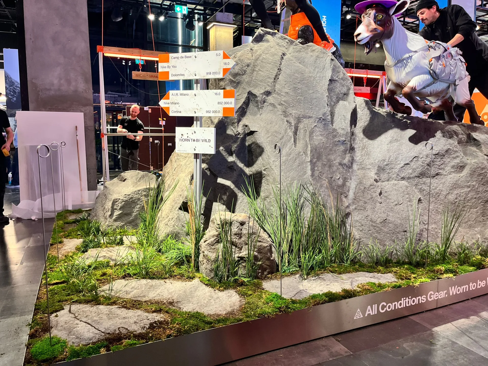 The entire tall rock with planting and mannequins in a Paris clothing display