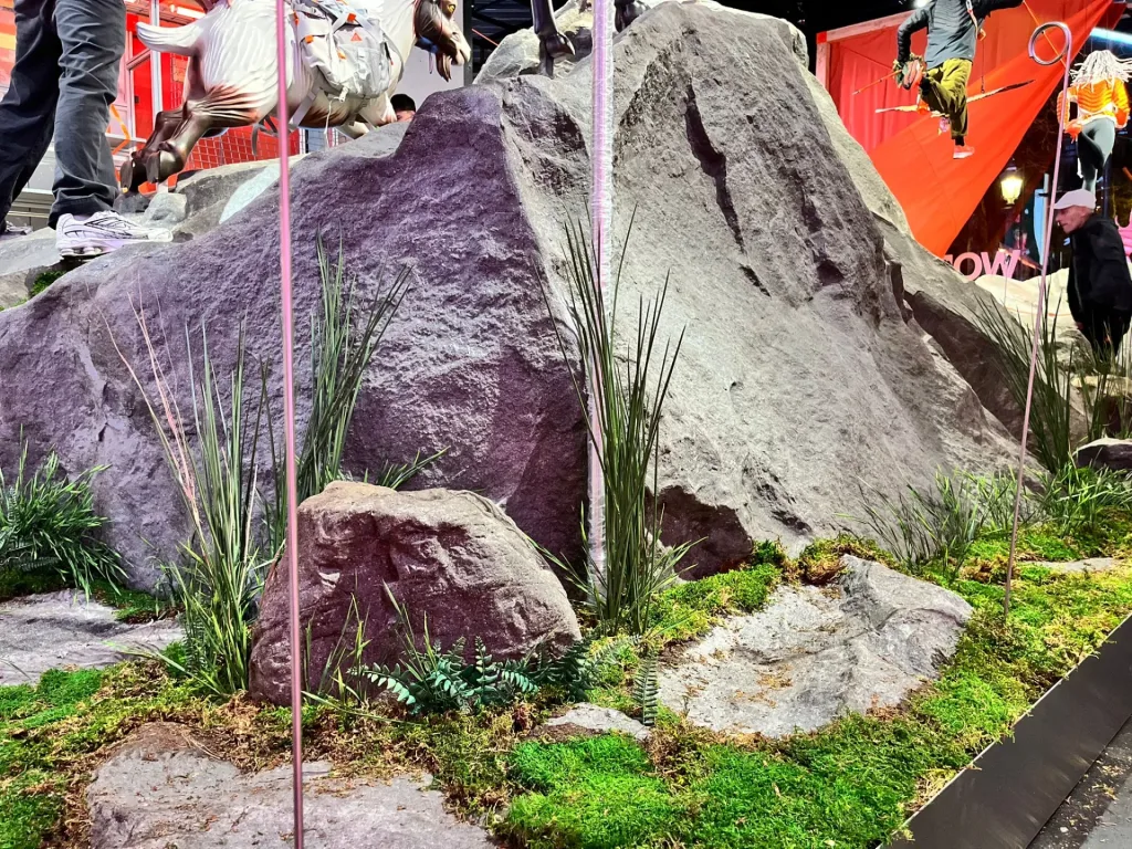 Large rock texture and grasses in a mountain-themed shop display
