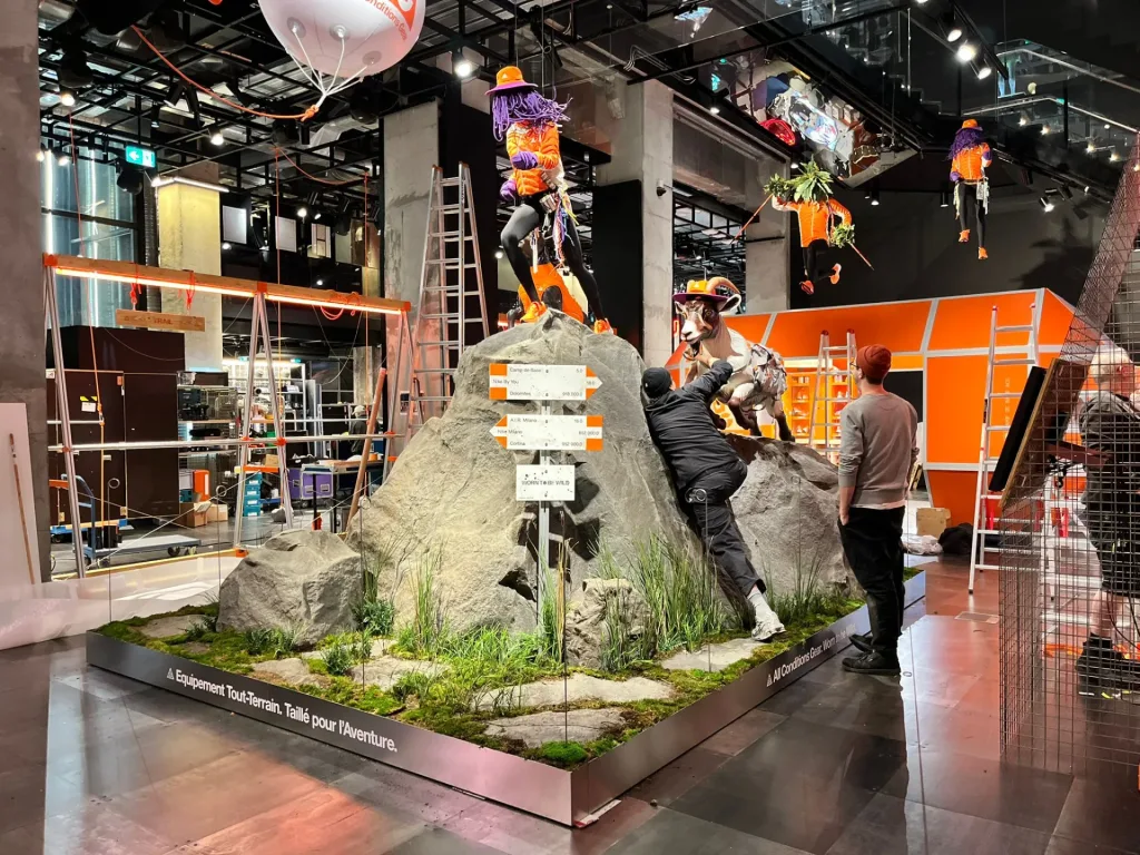 Work on the tall rock display arrangement in the Paris shop