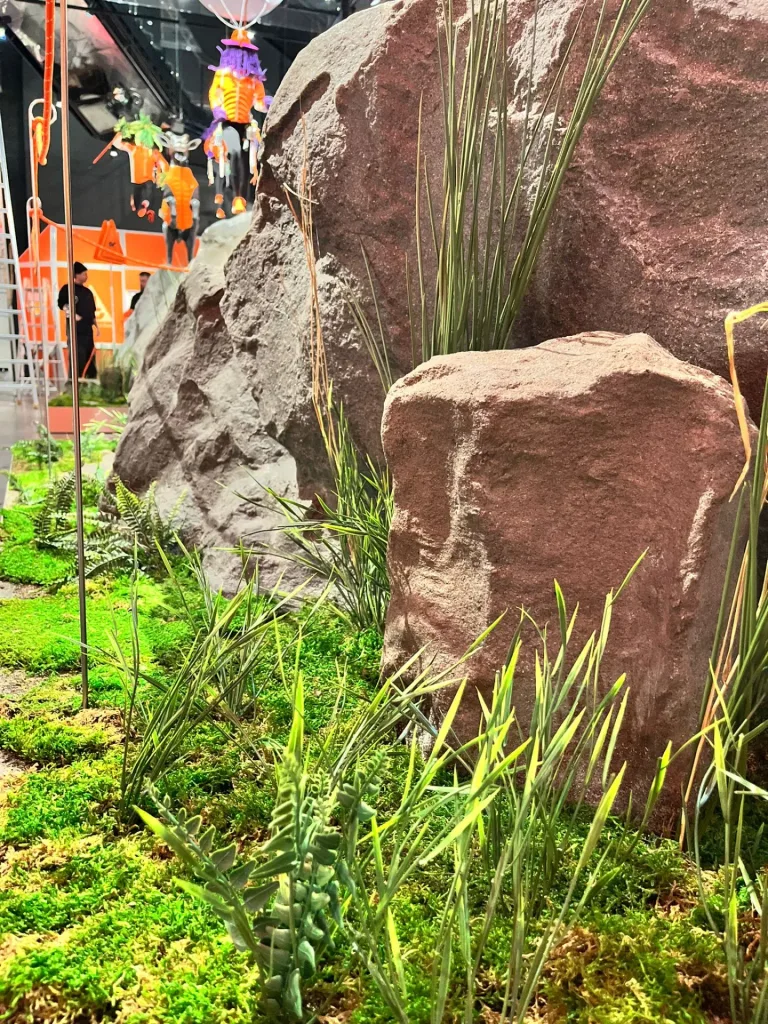 Artificial planting details at the base of a decorative rock
