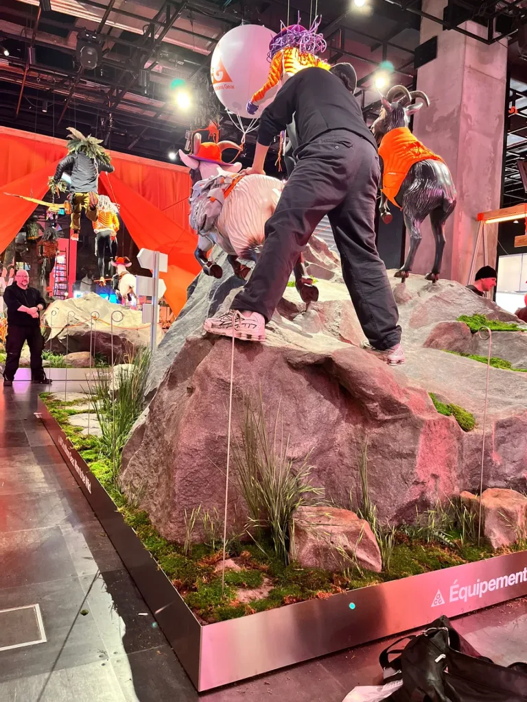 Side view of a tall rock display for mountain clothing